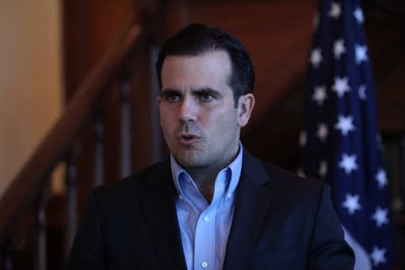 FILE PHOTO: Puerto Rico Governor Rossello speaks during a Facebook live broadcast, in San Juan