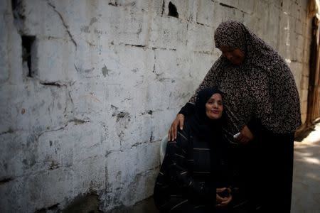 A relative of Palestinian teenager Loay Kheil, who was killed in an Israeli air strike, mourns during his funeral in Gaza City July 15, 2018. REUTERS/Mohammed Salem