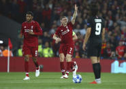 Liverpool's James Milner, centre, celebrates after he scores his sides second goal during the Champions League Group C soccer match between Liverpool and Paris-Saint-Germain at Anfield stadium in Liverpool, England, Tuesday, Sept. 18, 2018. (AP Photo/Dave Thompson)