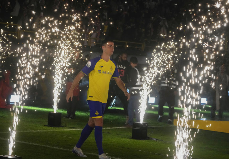 Cristiano Ronaldo walks during his official unveiling as a new member of Al Nassr soccer club in in Riyadh, Saudi Arabia, Tuesday, Jan. 3, 2023. Ronaldo, who has won five Ballon d'Ors awards for the best soccer player in the world and five Champions League titles, will play outside of Europe for the first time in his storied career. (AP Photo/Amr Nabil)