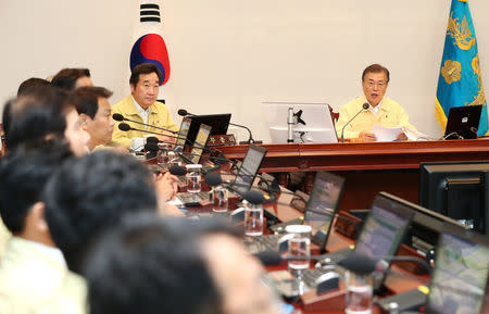 South Korean President Moon Jae-in presides over a cabinet meeting at the Presidential Blue House in Seoul, South Korea, August 21, 2017. Kim Ju-hyoung/Yonhap via REUTERS ATTENTION EDITORS - THIS IMAGE HAS BEEN SUPPLIED BY A THIRD PARTY. SOUTH KOREA OUT. NO RESALES. NO ARCHIVE.