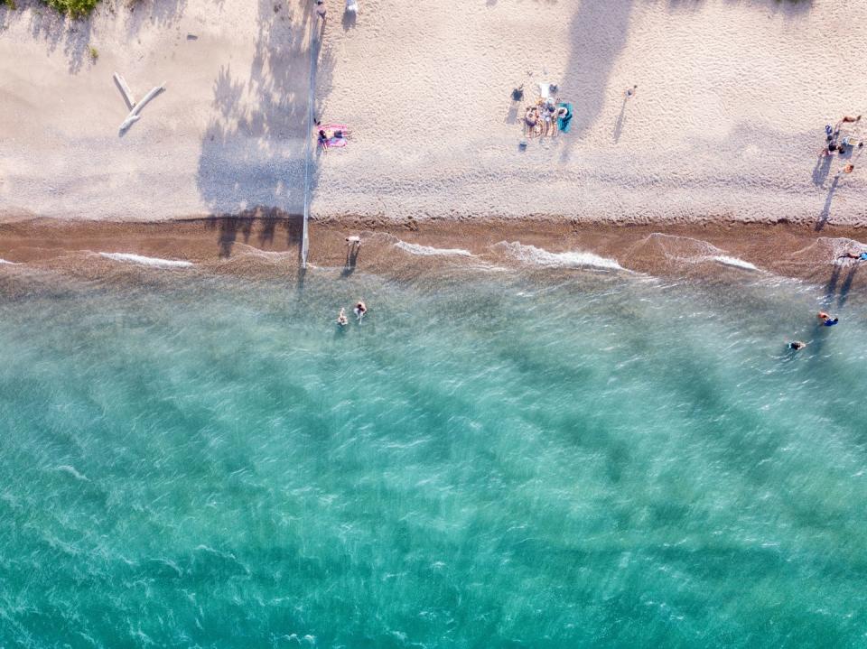 drone view of the beautiful blue water and sandy beaches of lake huron