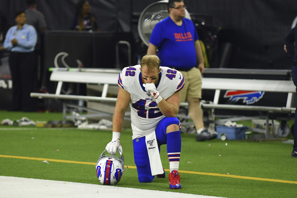 Buffalo Bills running back Patrick DiMarco (42) kneels on the sideline after an NFL wild-card playoff football game against the Houston Texans Saturday, Jan. 4, 2020, in Houston. The Texans won 22-19 in overtime.(AP Photo/Eric Christian Smith)