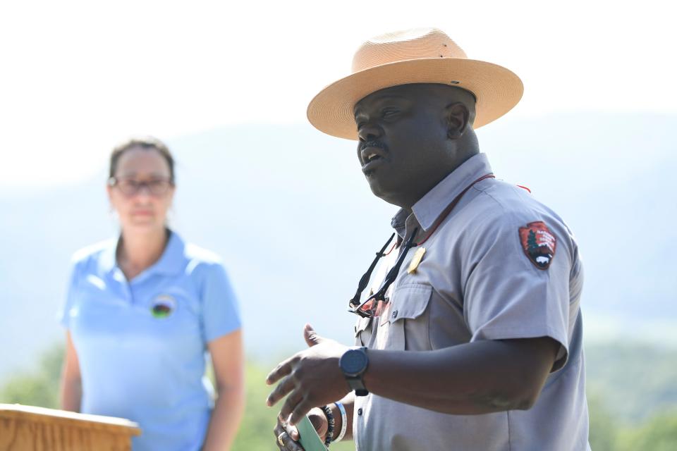Superintendent of Great Smoky Mountains National Park Cassius Cash speaks about President Biden’s Investing in America agenda and the Great American Outdoors Act at an overlook off of the FootHills Parkway, Friday, Aug. 25, 2023.