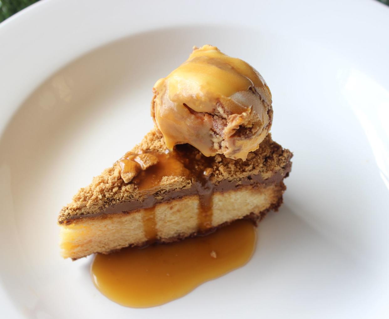 A golden cheesecake with honeycomb crumble, ice-cream and salted caramel