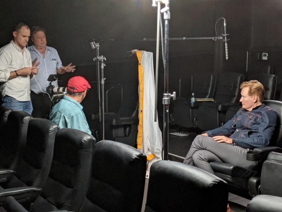 Patrick Cone, cameraman, Barry Rubinow, director and Doug Romoff, co-producer, interview Conan O’Brien for “Banded Together.”