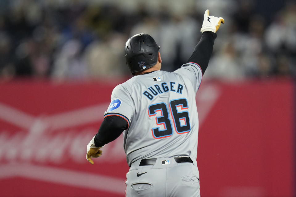 Miami Marlins' Jake Burger gestures as he runs the bases after hitting a three-run home run against the New York Yankees during the third inning of the baseball game at Yankee Stadium, Wednesday, April 10, 2024, in New York. (AP Photo/Seth Wenig)