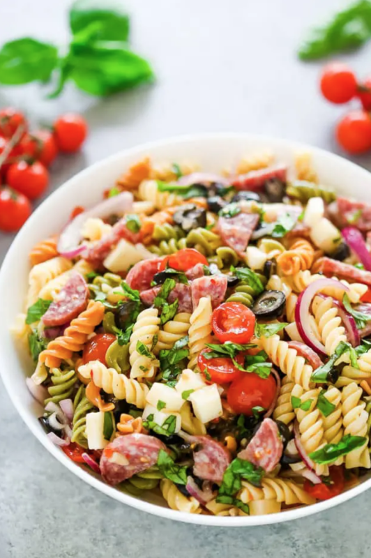 <p>Gal on a Mission</p><p>Italian pasta salad is always a winner with tri-color rotini pasta loaded with sliced cherry tomatoes, fresh basil, black olives, quartered salami and diced mozzarella cheese.</p><p><strong>Get the recipe: <a href="https://www.galonamission.com/italian-pasta-salad/" rel="nofollow noopener" target="_blank" data-ylk="slk:Italian Pasta Salad;elm:context_link;itc:0;sec:content-canvas" class="link rapid-noclick-resp"><em>Italian Pasta Salad</em></a></strong></p>