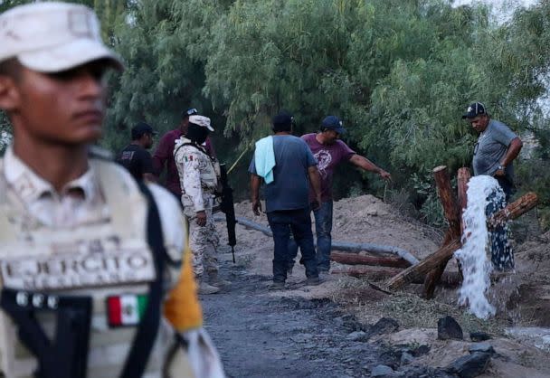 PHOTO: Volunteers drain water from a flooded and collapsed coal mine where miners are trapped in Sabinas, Coahuila state, Mexico, Aug. 4, 2022. (Alfredo Lara/AP)