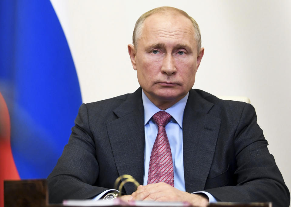 Russian President Vladimir Putin listens to Moscow Mayor Sergei Sobyanin during their meeting via teleconference at the Novo-Ogaryovo residence outside Moscow, Russia, Wednesday, May 27, 2020. Moscow mayor announced easing lockdown restrictions in the city starting from June 1, сiting the slowing of the coronavirus outbreak in Russia's capital. (Alexei Nikolsky, Sputnik, Kremlin Pool Photo via AP)