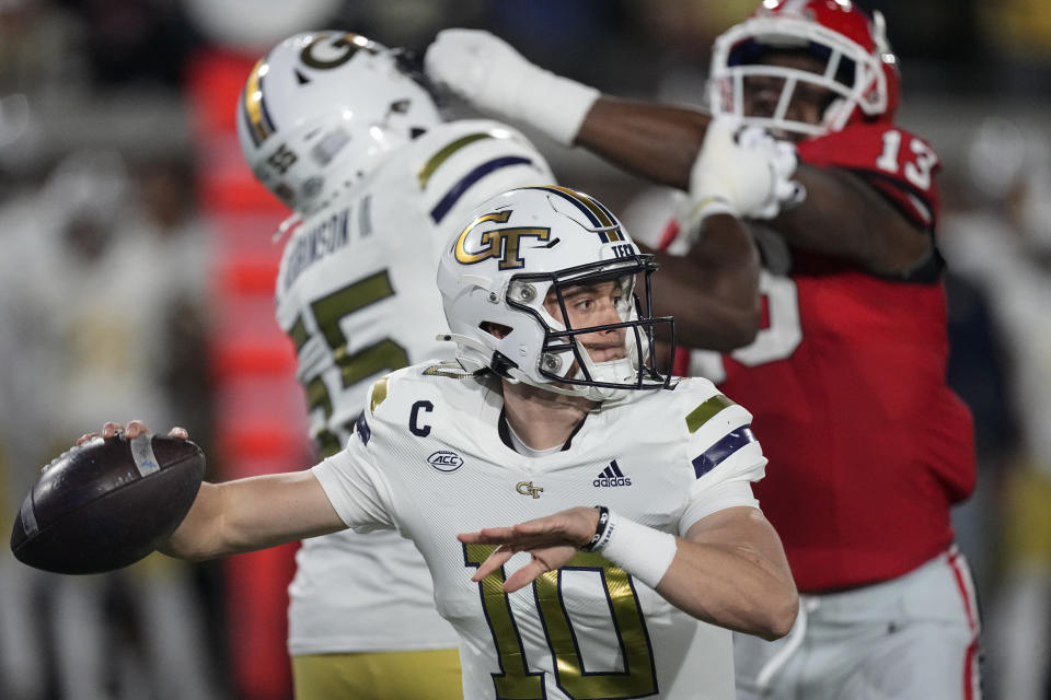 Georgia Tech quarterback Haynes King (10) looks for an open receiver during the first half of an NCAA college football game against Georgia, Saturday, Nov. 25, 2023, in Atlanta. (AP Photo/John Bazemore)