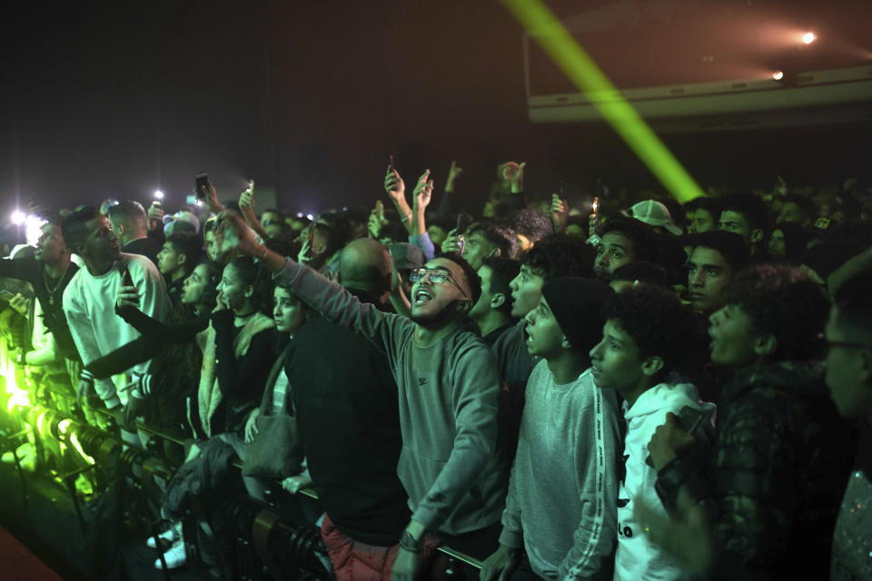 In this Friday, Nov. 22, 2019 photo, rap music fans attend a concert for Moroccan rappers as part of the Visa for Music festival in Rabat, Morocco. (AP Photo/Mosa'ab Elshamy)