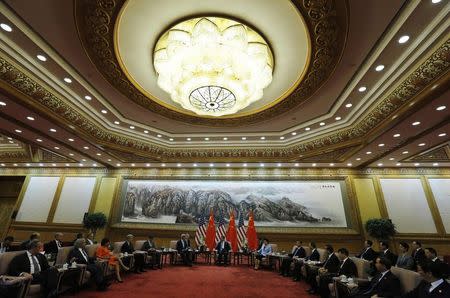 U.S. Secretary of State John Kerry meets with China's President Xi Jinping at the Great Hall of the People in Beijing July 10, 2014. REUTERS/Jim Bourg