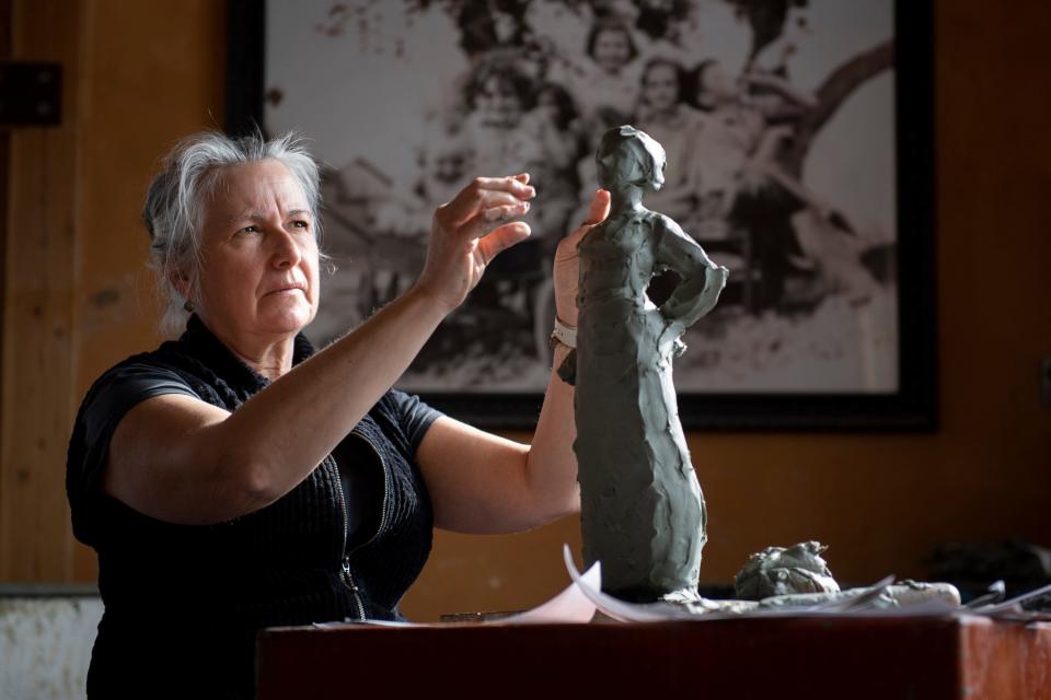 Sculptor Jane DeDecker works on a sculpture of Jovita Idar Vivero in her studio in Loveland, Colo., on Wednesday, Feb. 23, 2022.