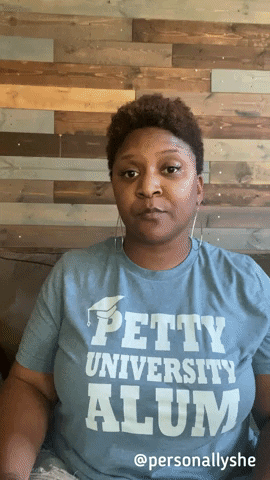 A woman wearing a "Petty University Alum" T-shirt