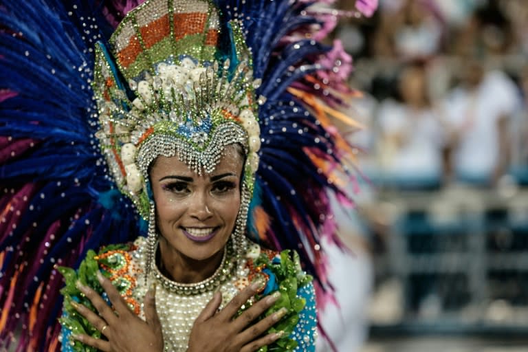 A dancer with the Uniao da Ilha samba school performs during the first night of the carnival parade at the Sambadrome in Rio de Janeiro, on February 7, 2016