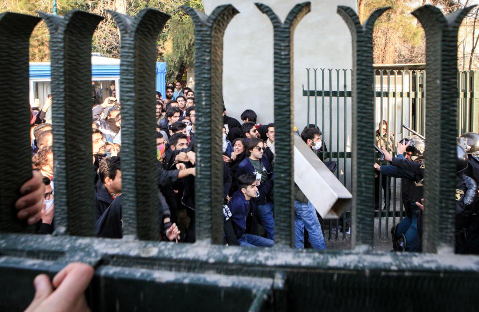 <p>Iranian students clash with riot police during an anti-government protest around the University of Tehran, Iran, Dec. 30, 2017. (Photo: STR/EPA-EFE/REX/Shutterstock) </p>