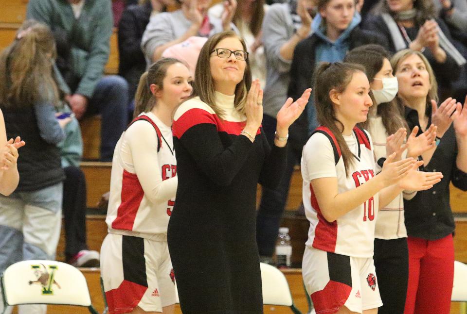 CVU coach Ute Otley looks up at the scoreboard as the final whistle sounds in the Redhawks 43-29 semifinal win over Essex in 2023.