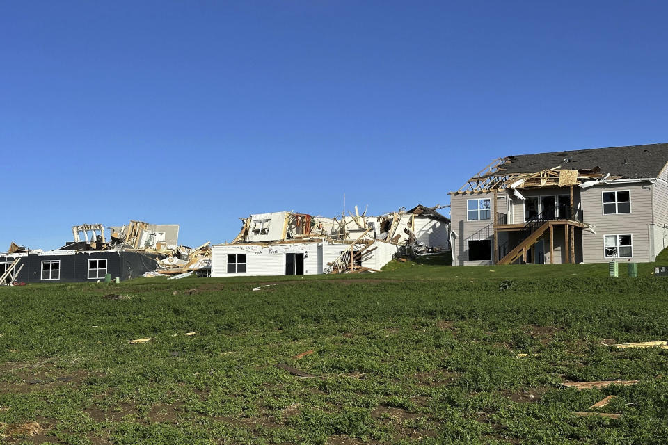 Debris surround destroyed and damaged homes in Elkhorn, Neb., on Saturday, April 27, 2024. Residents began sifting through the rubble after a tornado plowed through suburban Omaha, demolishing homes and businesses as it moved for miles through farmland and into subdivisions. (AP Photo/Nicholas Ingram)