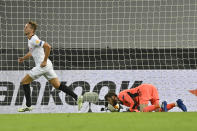 Sevilla's Luuk de Jong celebrates after he scored his side's second goal during an Europa League semifinal match between Sevilla and Manchester United, in Cologne, Germany, Sunday, Aug. 16, 2020. (AP Photo/Martin Meissner, Pool)