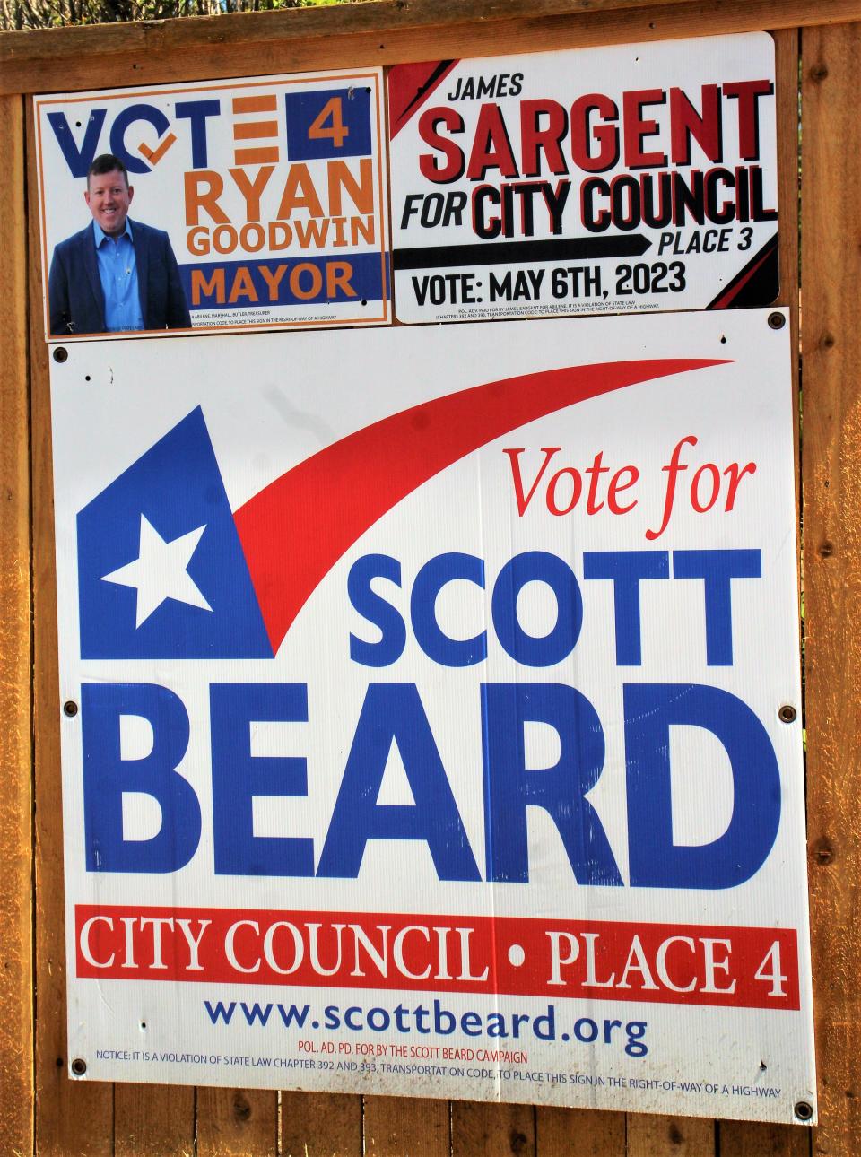 Campaign signs for Ryan Goodwin, James Sargent and Scott Beard are affixed to a fence at a home in southwest Abilene.