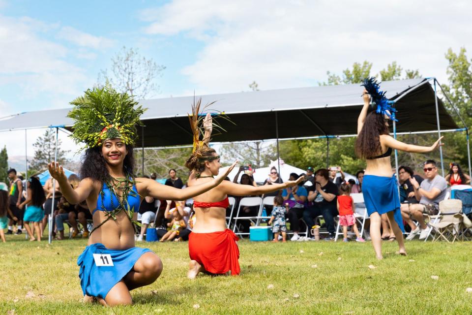 Aitofi Liavaa, left, and other dancers compete at the Tahitian Competition during Polynesian Days Utah at Electric Park at Thanksgiving Point in Lehi on Saturday.