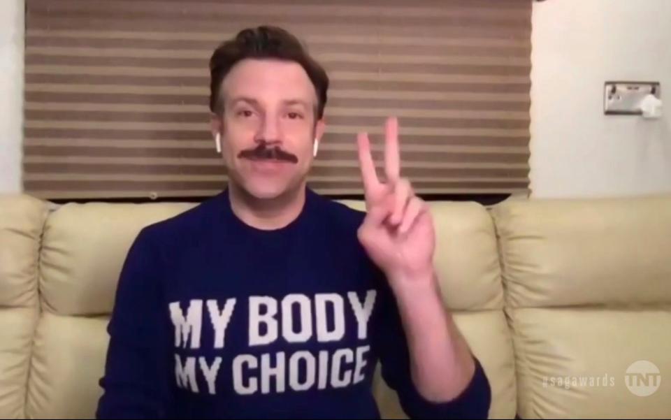 Jason Sudeikis accepts the award for outstanding performance by a male actor in a comedy series for "Ted Lasso" during the 27th annual Screen Actors Guild Awards.