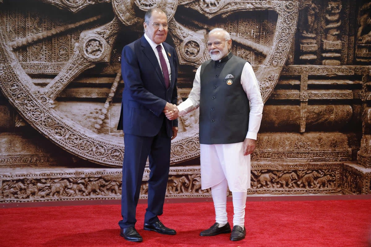 India's Prime Minister Narendra Modi (R) shakes hand with Russian Foreign Minister Sergei Lavrov (POOL/AFP via Getty Images)