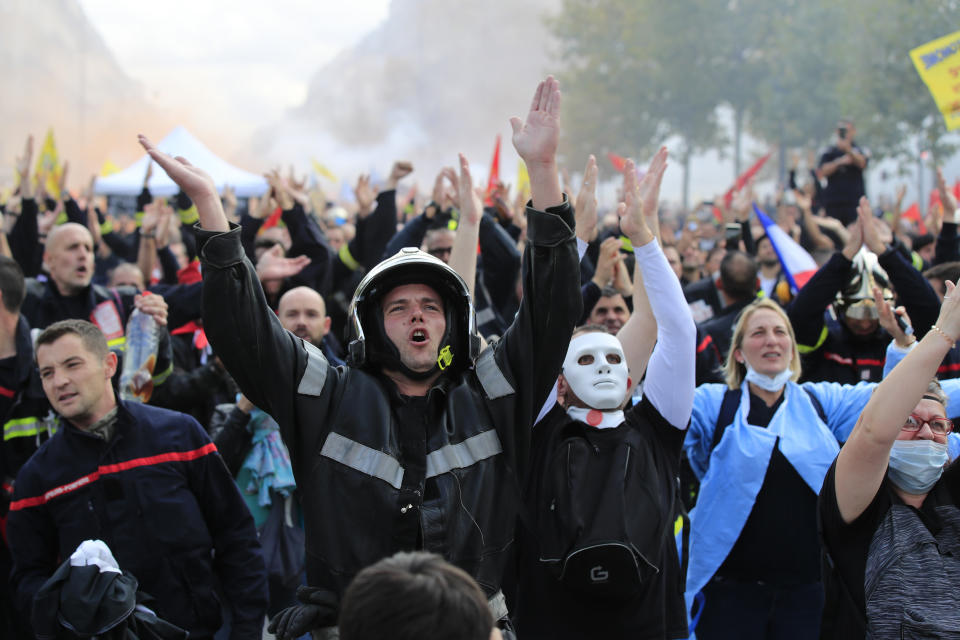 Firemen protest with hospital staff on wages, working conditions and pensions, Tuesday, Oct. 15, 2019 in Paris. (AP Photo/Michel Euler)