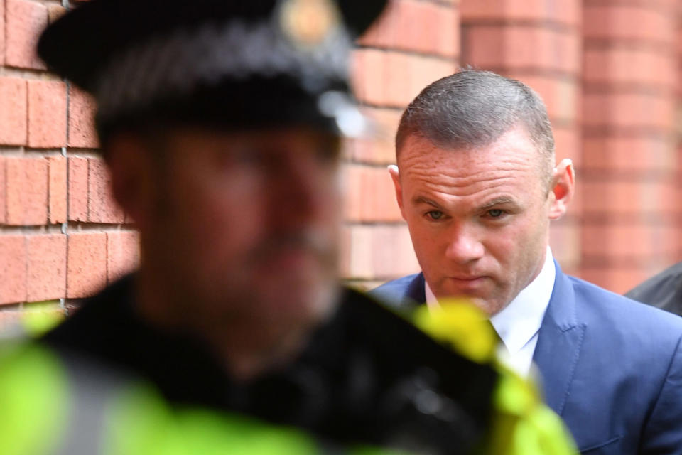Footballer Wayne Rooney spotted carrying out community service after drink-driving offence