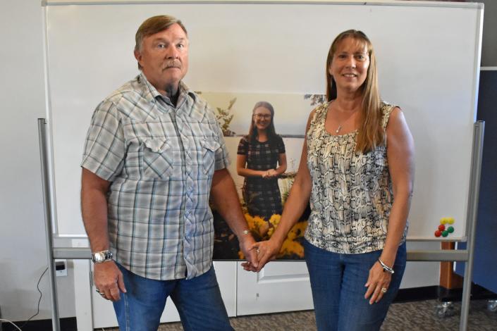 Terry and Mia Montang pose with a photo of their daughter Eden Mariah Montang, who was killed in a shooting at Cornerstone Church in Ames June 2. The Montangs were photographed July 14, 2022, at Cornerstone Church in Boone.