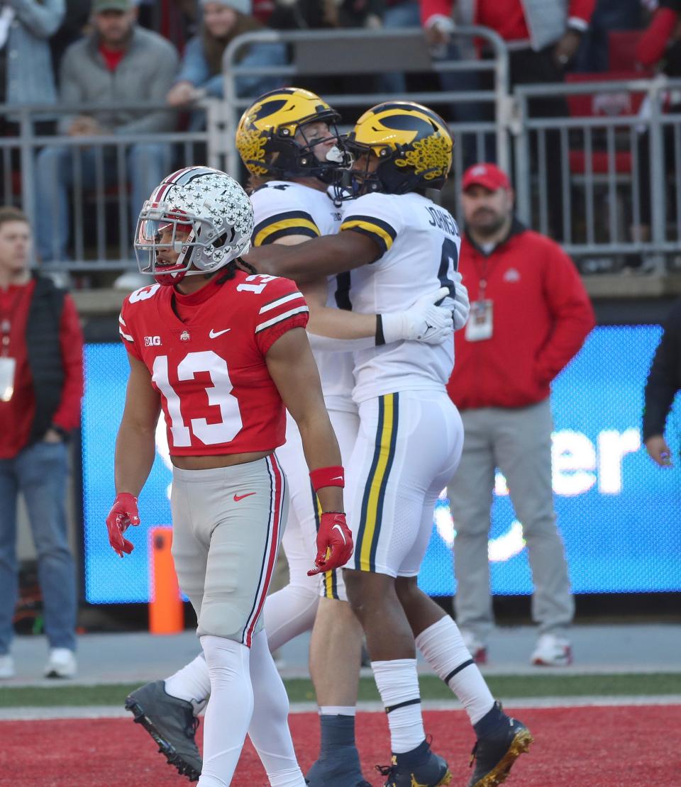 Michigan wide receiver Cornelius Johnson (6) celebrates his second touchdown catch against Ohio State during the first half at Ohio Stadium in Columbus on Nov. 26, 2022.