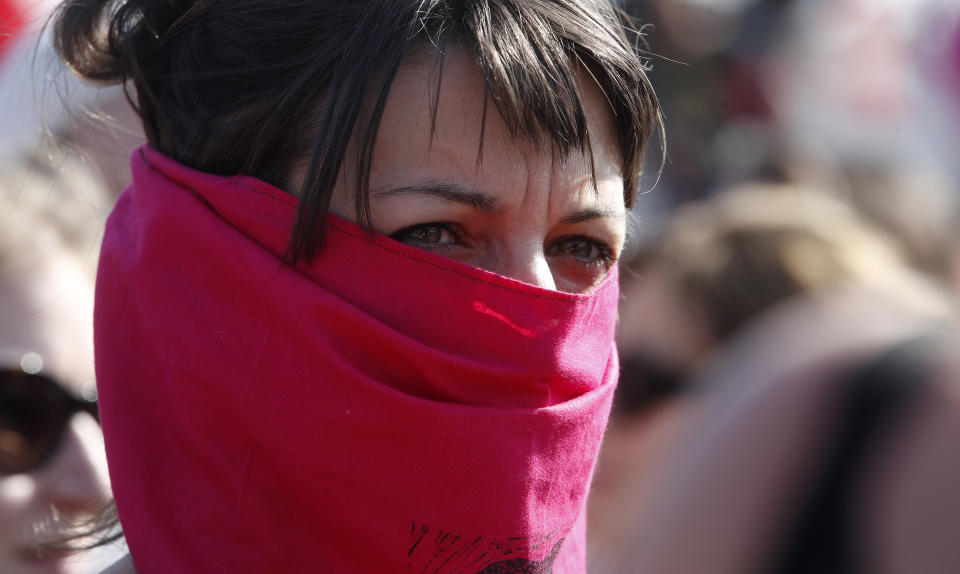 A woman takes part in a march to protest the World Congress of Families, in Verona, Italy, Saturday, March 30, 2019. A congress in Italy under the auspices of a U.S. organization that defines family as strictly centering around a mother and father has made Verona — the city of Romeo and Juliet — the backdrop for a culture clash over family values, with a coalition of civic groups mobilizing against what they see as a counter-reform movement to limit LGBT and women's rights. (AP Photo/Antonio Calanni)