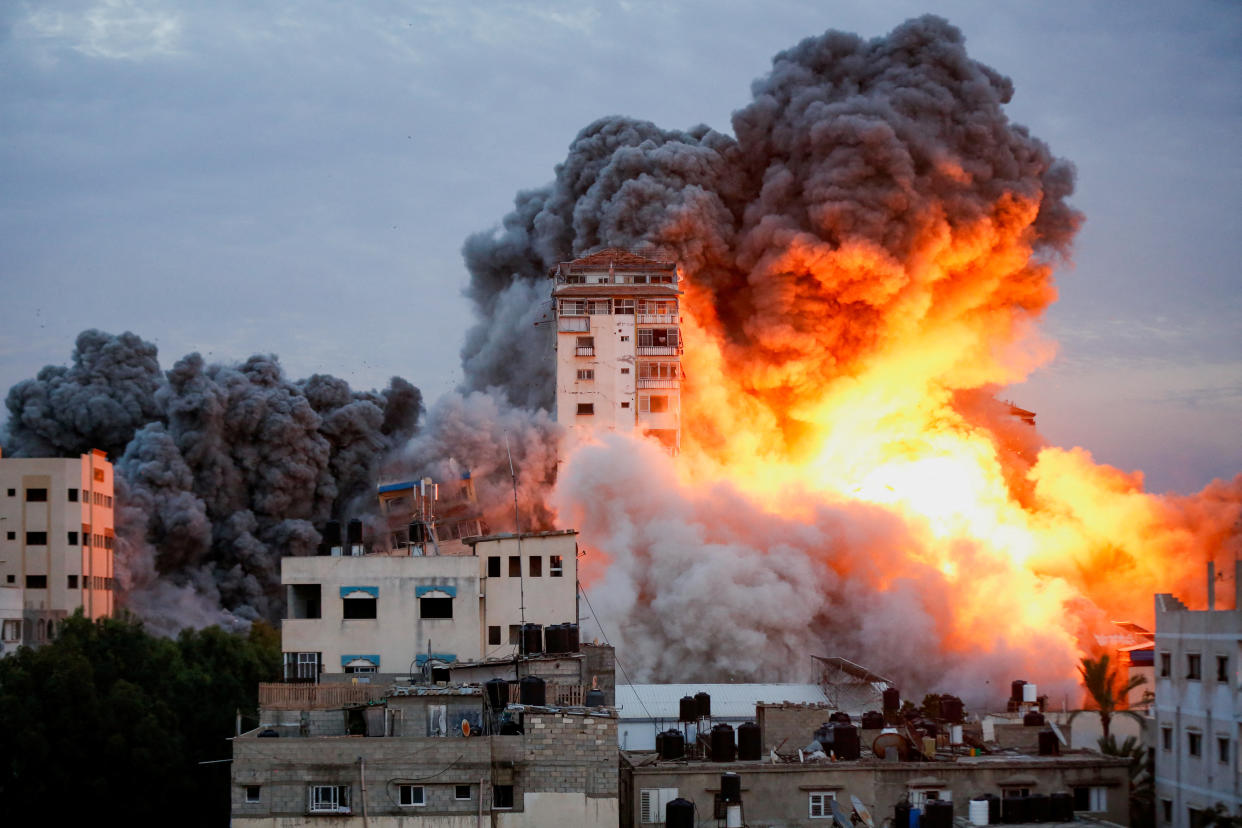 Smoke and flames billow after Israeli forces struck a high-rise tower in Gaza City on Saturday. (Ashraf Amra/Reuters)