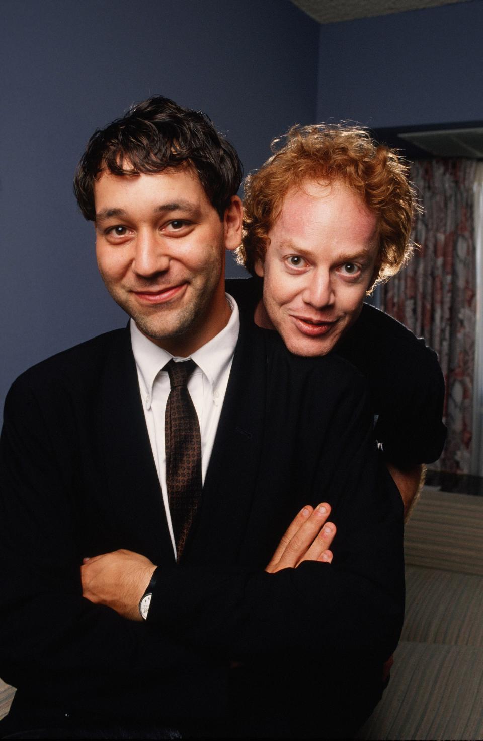 BEVERLY HILLS, CA - 1990: Film Director Sam Raimi (left) and film composer Danny Elfman get playful during a 1990 Beverly Hills, California, photo portrait session. Raimi is best known for the 