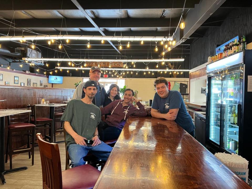 Dough Boys partners Chris Gregory and his wife, Kim Gregory, back row; Mike Kelly, front from left; Megan Gorden, and Brendan Dobis talked to an The Island Packet reporter at their new Bluffton pizza restaurant.