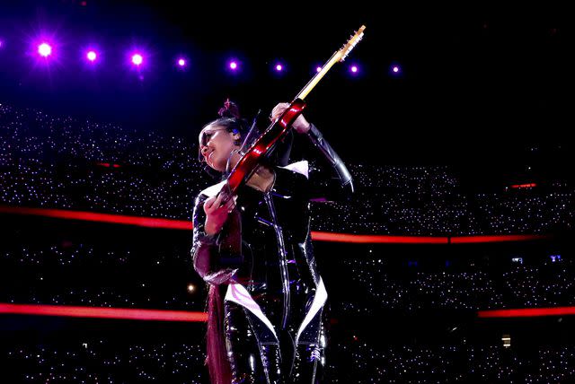 <p>Kevin Mazur/Getty</p> H.E.R. performs during the Super Bowl Halftime Show in Las Vegas on Feb. 11, 2024