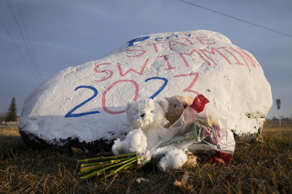 Teddy bears and flowers are seen outside of Perry High School following a shooting Thursday at the school, Friday, Jan. 5, 2024, in Perry, Iowa. (AP Photo/Charlie Neibergall)