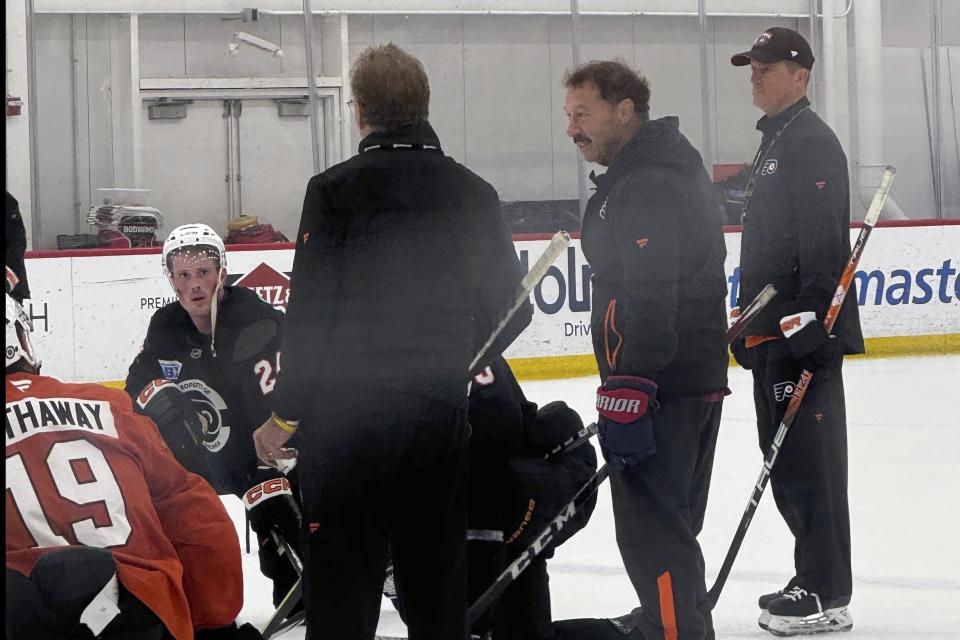 The Philadelphia Flyers host Guy Gaudreau, second from right, the father of Johnny and Matthew Gaudreau, at the team's morning skate, Monday, Sept. 23, 2024, in Voorhees, N.J. (The Philadelphia Inquirer via AP)