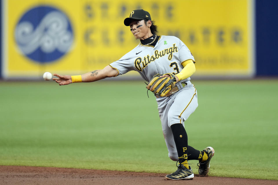 Pittsburgh Pirates second baseman Ji Hwan Bae throws the ball to first in time to throw out Tampa Bay Rays' Manuel Margot during the third inning of a baseball game Thursday, May 4, 2023, in St. Petersburg, Fla. (AP Photo/Chris O'Meara)