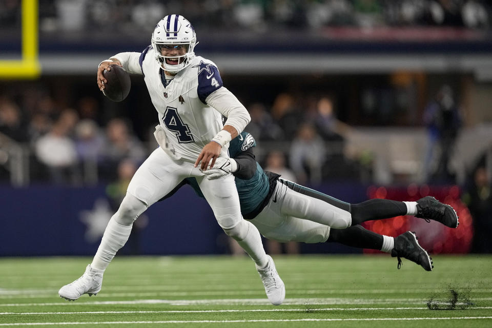 Dallas Cowboys quarterback Dak Prescott (4) is hit by Philadelphia Eagles linebacker Haason Reddick during the second half of an NFL football game, Sunday, Dec. 10, 2023, in Arlington, Texas. The Cowboys won 33-13.(AP Photo/Sam Hodde)