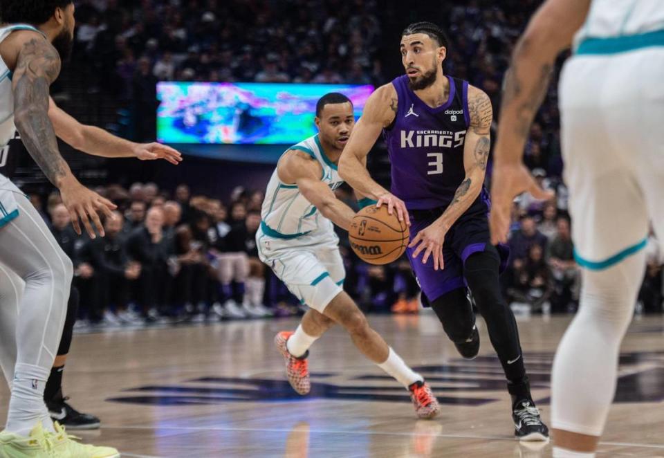 Sacramento Kings guard Chris Duarte (3) makes a pass during an NBA game between the Sacramento Kings and the Charlotte Hornets on Tuesday at Golden 1 Center.