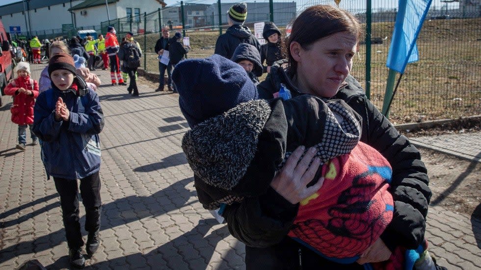 Ukrainian refugees arrive at the crossing border in Medyka, southeastern Poland