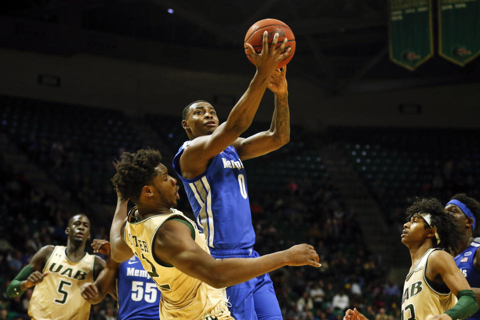 Memphis forward D.J. Jeffries (0) puts up a shot over UAB forward Will Butler (12) during the second half of an NCAA college basketball game Saturday, Dec. 7, 2019, in Birmingham, Ala. (AP Photo/Butch Dill)