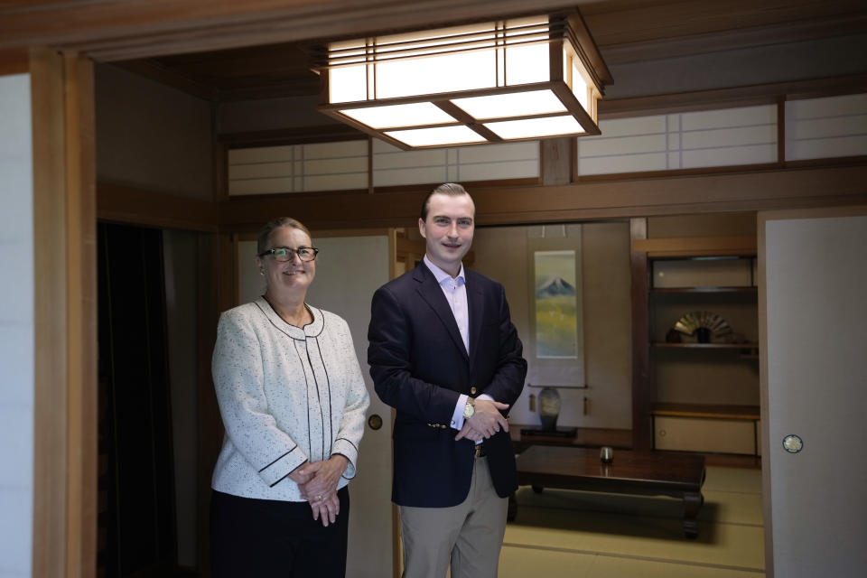 Parker J. Allen, right, and his mother and business partner Linda Allen pose for a photo before an interview with The Associated Press at Linda Allen's home in Ogawamachi, northwest of Tokyo, Friday, May 6, 2022. The Japanese yen has weakened, trading in recent weeks at 20-year lows of 130 yen to the U.S. dollar just when prices of oil and other goods are surging due to the war in Ukraine, and that's a mixed blessing. The news on the weakening yen hasn’t been all bad for some including Allen. Interest is picking up, said Allen, who runs a business finding bargain-priced homes in the Japanese countryside and suburban Tokyo for foreign buyers looking for a second home or office. (AP Photo/Hiro Komae)