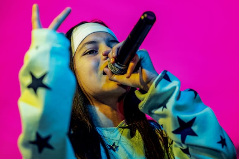 Venezuelan Gabriela Brito, whose stage name is Lela MC, performs during a Hip-hop Festival in Bogota, Colombia, on March 10, 2024. Lela MC, a 13-year-old migrant in Bogota and a new revelation in Latin hip-hop, has just signed a contract with a major record label after spending several years rapping on buses in the Colombian capital. (Alejandro MARTINEZ)