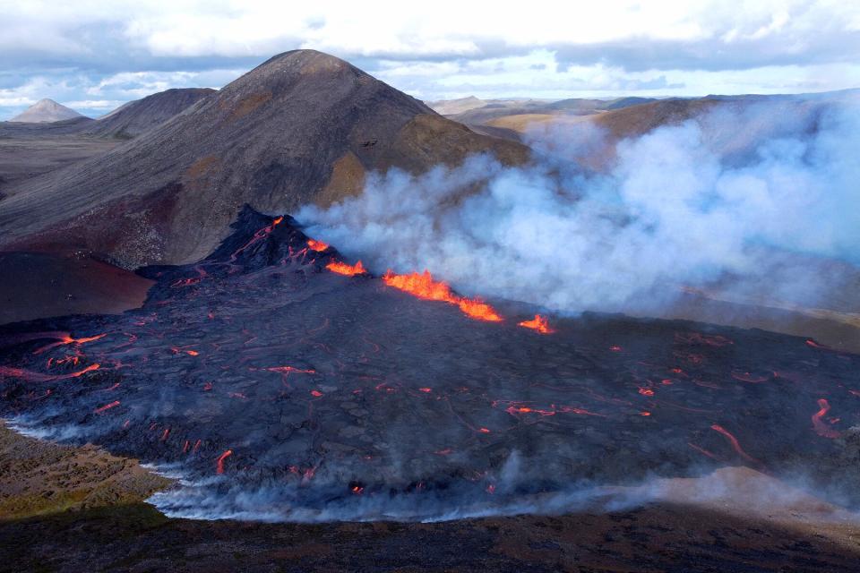 Lava erupts and flows at the scene of the newly erupted volcano at Grindavik, Iceland on August 3, 2022