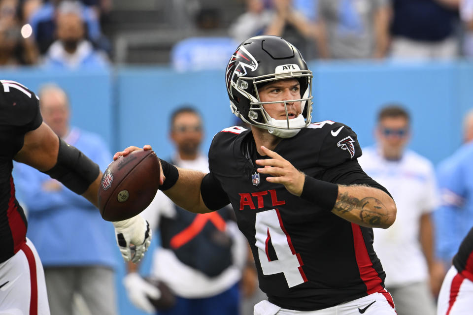 Atlanta Falcons quarterback Taylor Heinicke (4) looks for an open receiver during the second half of an NFL football game against the Tennessee Titans, Sunday, Oct. 29, 2023, in Nashville, Tenn. (AP Photo/John Amis)