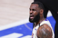 Los Angeles Lakers' LeBron James celebrates after making a 3-point shot during the first half of an NBA conference semifinal playoff basketball game against the Houston Rockets Saturday, Sept. 12, 2020, in Lake Buena Vista, Fla. (AP Photo/Mark J. Terrill)