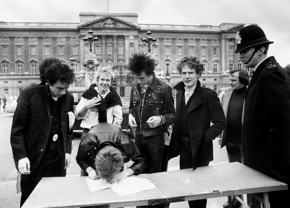 The Sex Pistols, signing a new recording contract with A&M Records, with Malcolm McLaren (Archive/PA) (PA Archive)